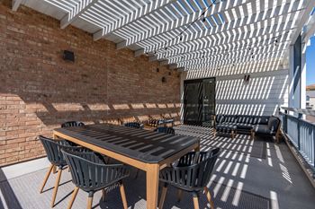 Long wooden table in pergola